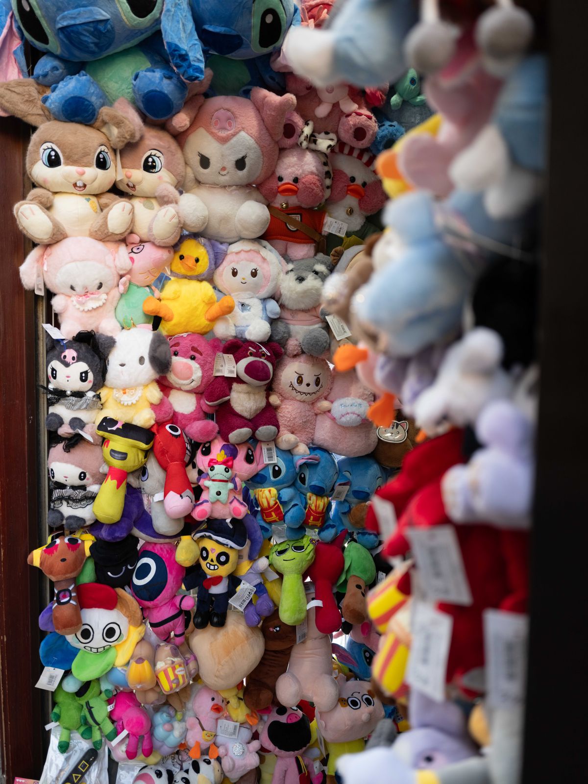 Stuffed toys displayed in front of a store
