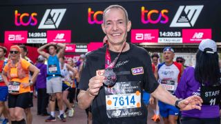 Jeremy Joseph wearing his London Marathon 2022 medal just after the finish line