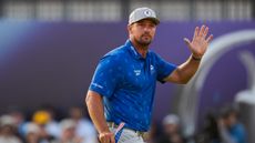 Bryson DeChambeau waves to the crowd at The Open