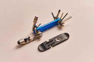 Park Tool IB-3 bike multi-tool on a beige background