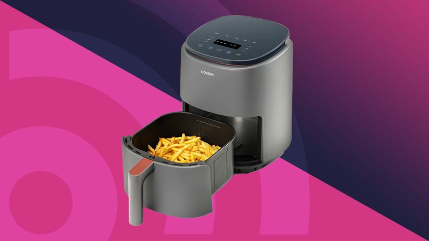 Cosori air fryer on pink and purple background