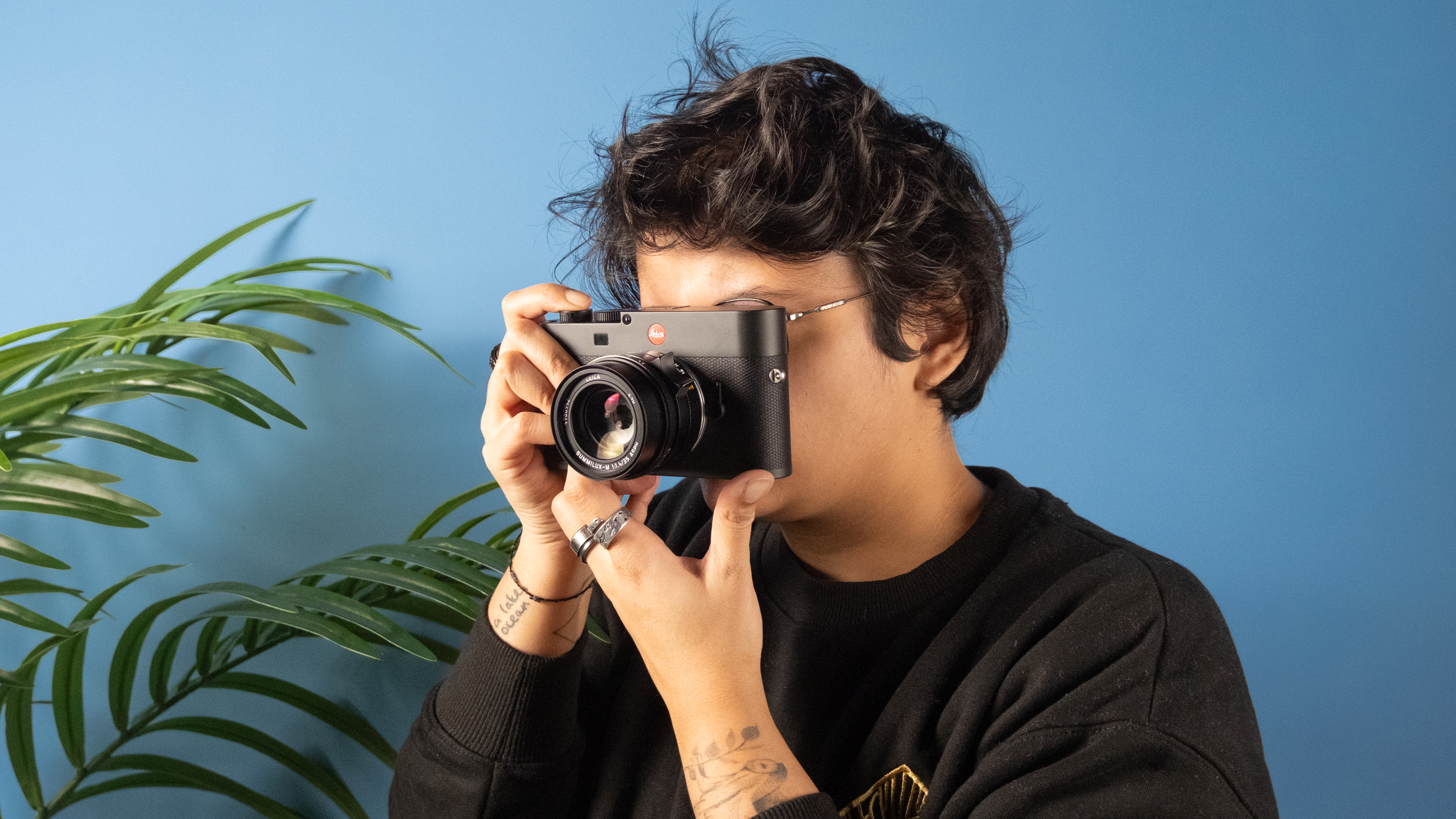 A black Leica M EV1 full frame mirrorless camera