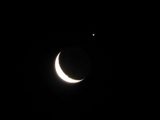 Veteran night sky photographer Giuseppe Petricca of Pisa, Italy, snapped this stunning view of the crescent moon, Jupiter and Jupiter's moons during a July 15, 2012 occultation.