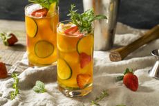 Pimm's in glasses with cucumber strawberries and mint