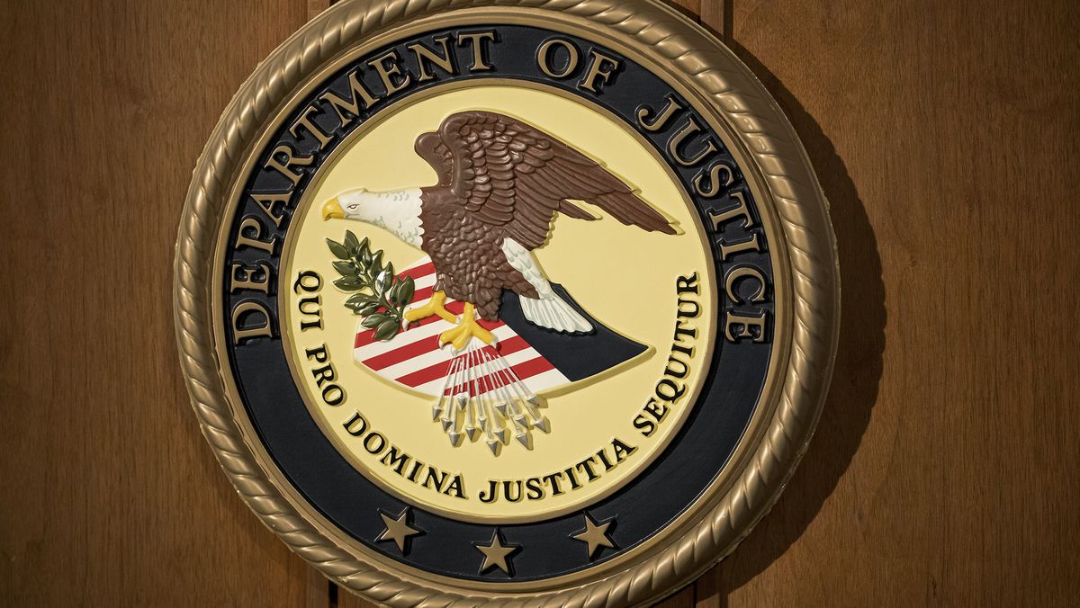 The Department of Justice seal on a podium during a news conference at the U.S. Attorney&#039;s Office in New York, U.S.