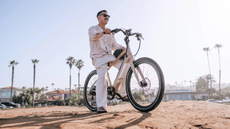 Man on bike outside in the sun