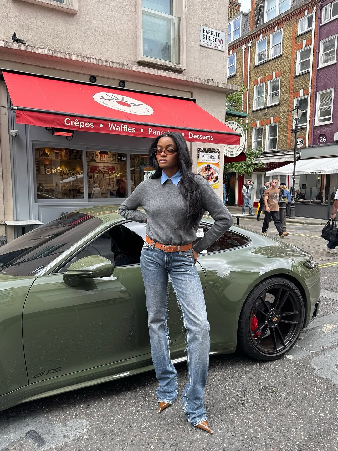 woman wearing holiday denim outfit 2025