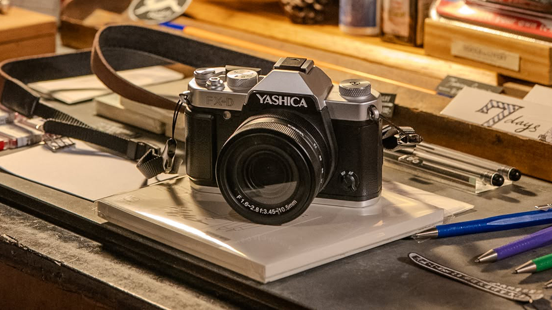 The Yashica FX-D sits on a desk