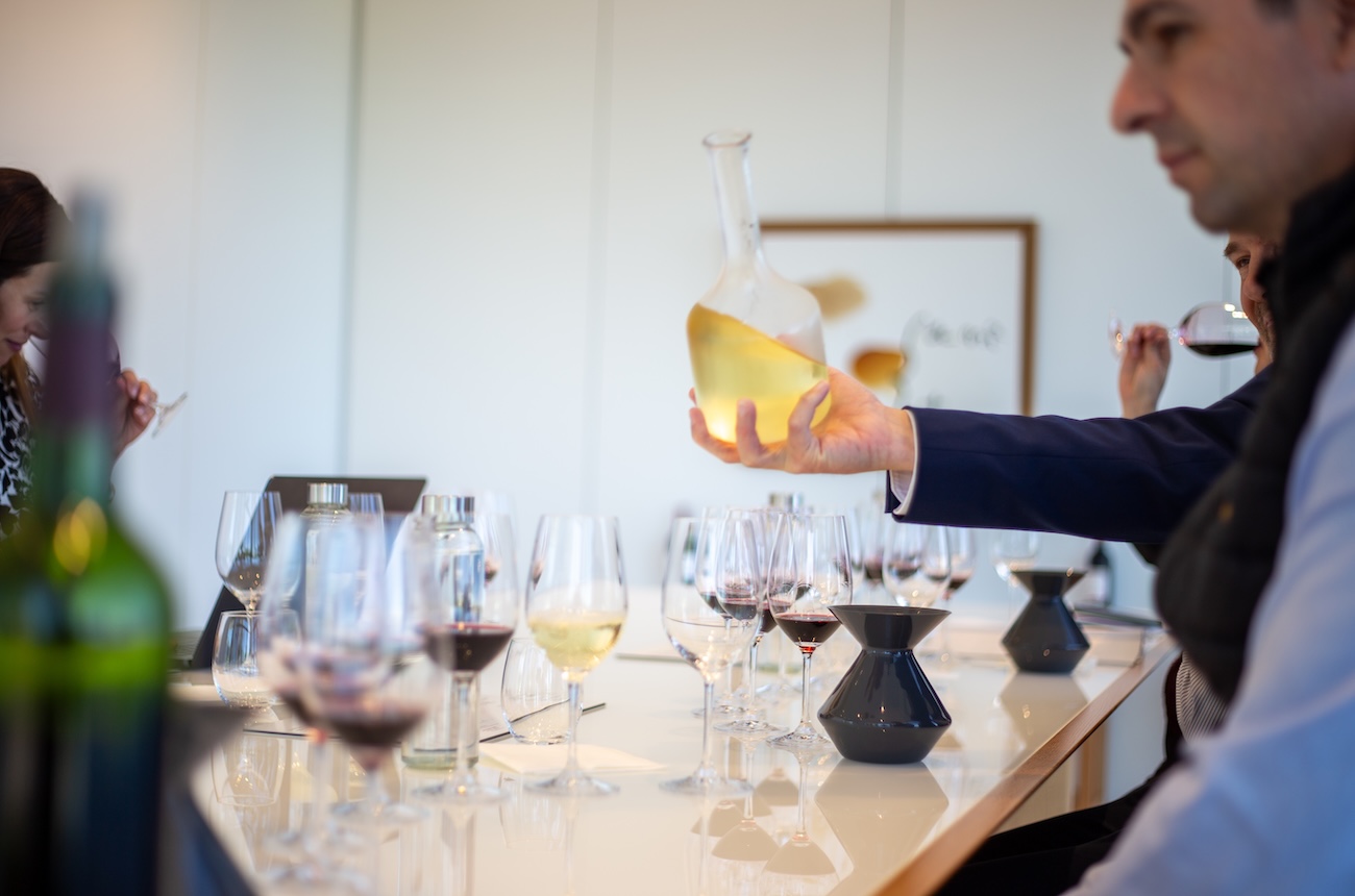 white wine being poured from a decanter