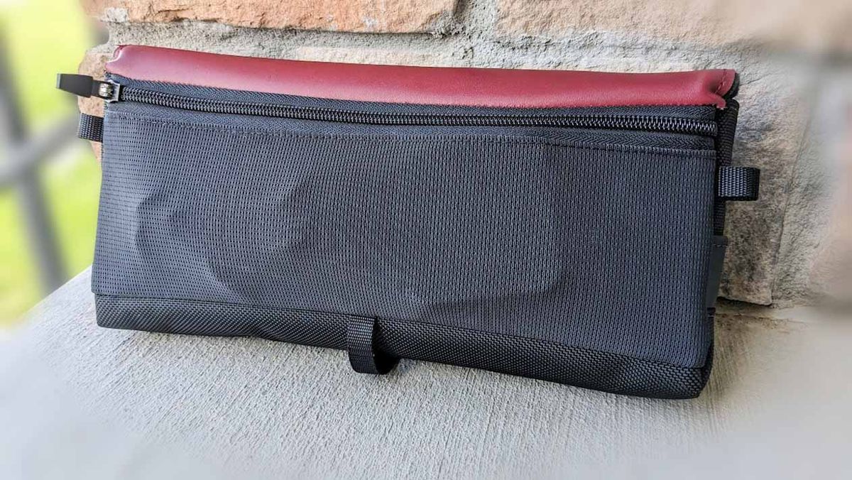 WaterField Designs CitySlicker carrying case with ROG Ally and charging cable inside.