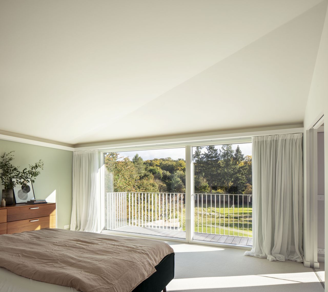 bedroom with balcony and view across grounds