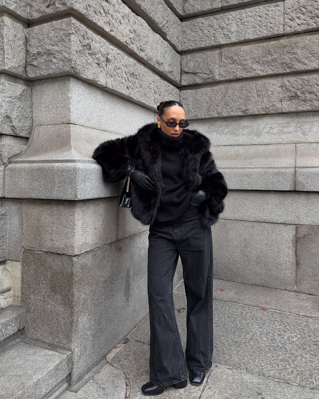 Ingrid in a black jacket, flares and loafers