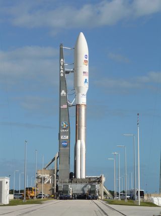 A closeup of NASA's Curiosity Rover and its Atlas 5 rocket as they sit on the launchpad on Nov. 25, 2011, a day before lifting off.