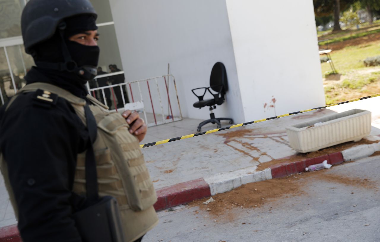 A Tunisian policeman guards the entrance to Tunis&amp;#039; Bardo museum.