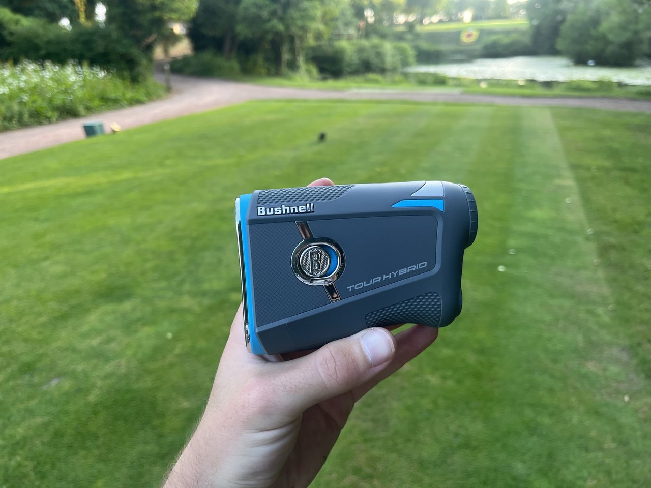 Bushnell Tour Hybrid Rangefinder being held in the tester's hand, showing the size of the device