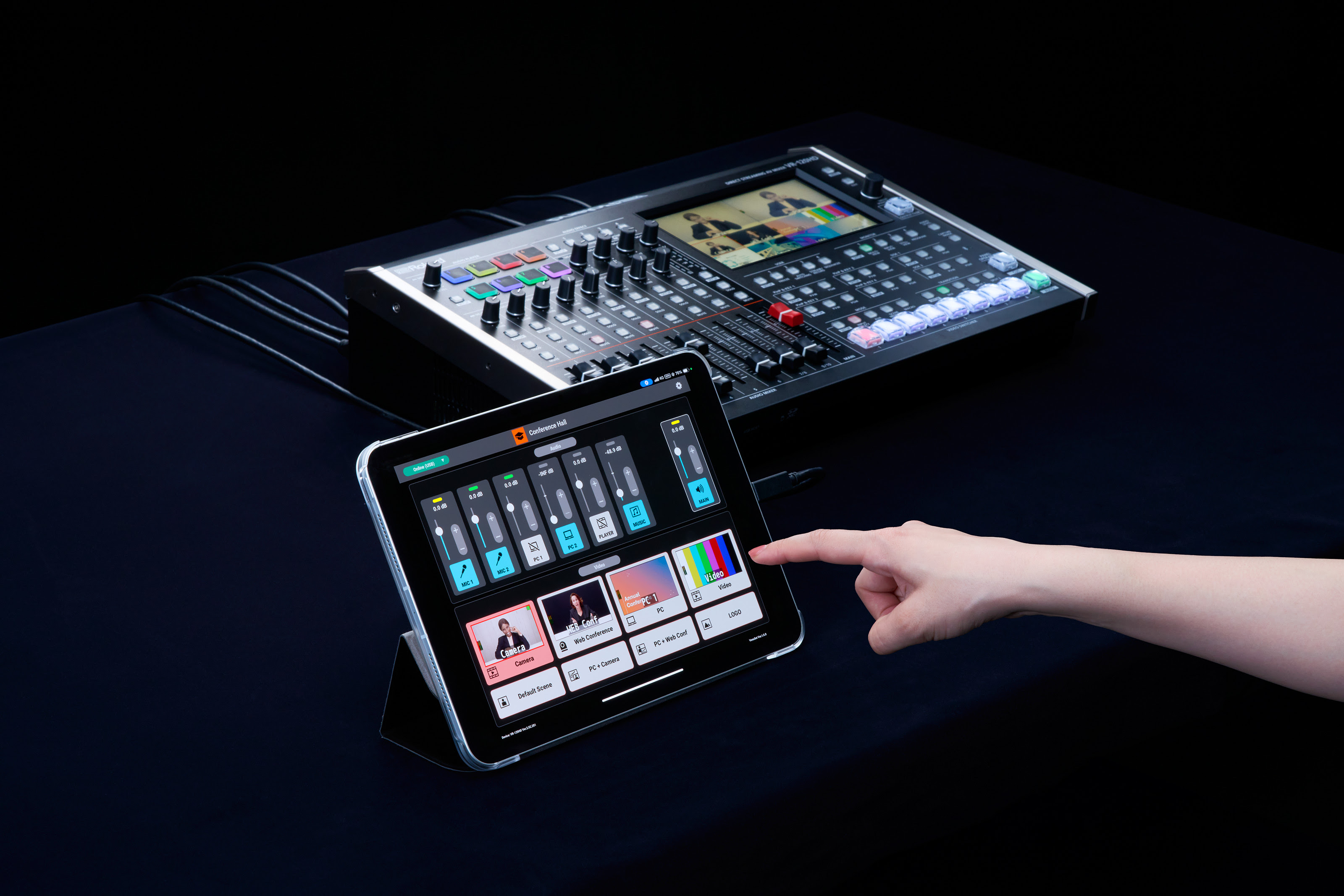 A new Roland app to enhance AV workflows being used on an iPad next to a mixer.