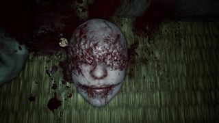 Hinako takes a key embedded in the head of a bloody mask in Silent Hill f