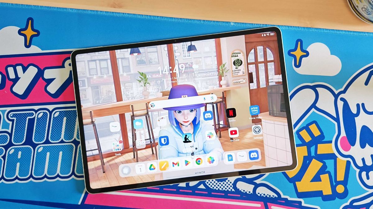 The Honor MagicPad 3 placed on a colorful desk mat.