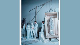 An image from a controversial Zara advert showing statues and a body-like shape wrapped in a white cloth in a box