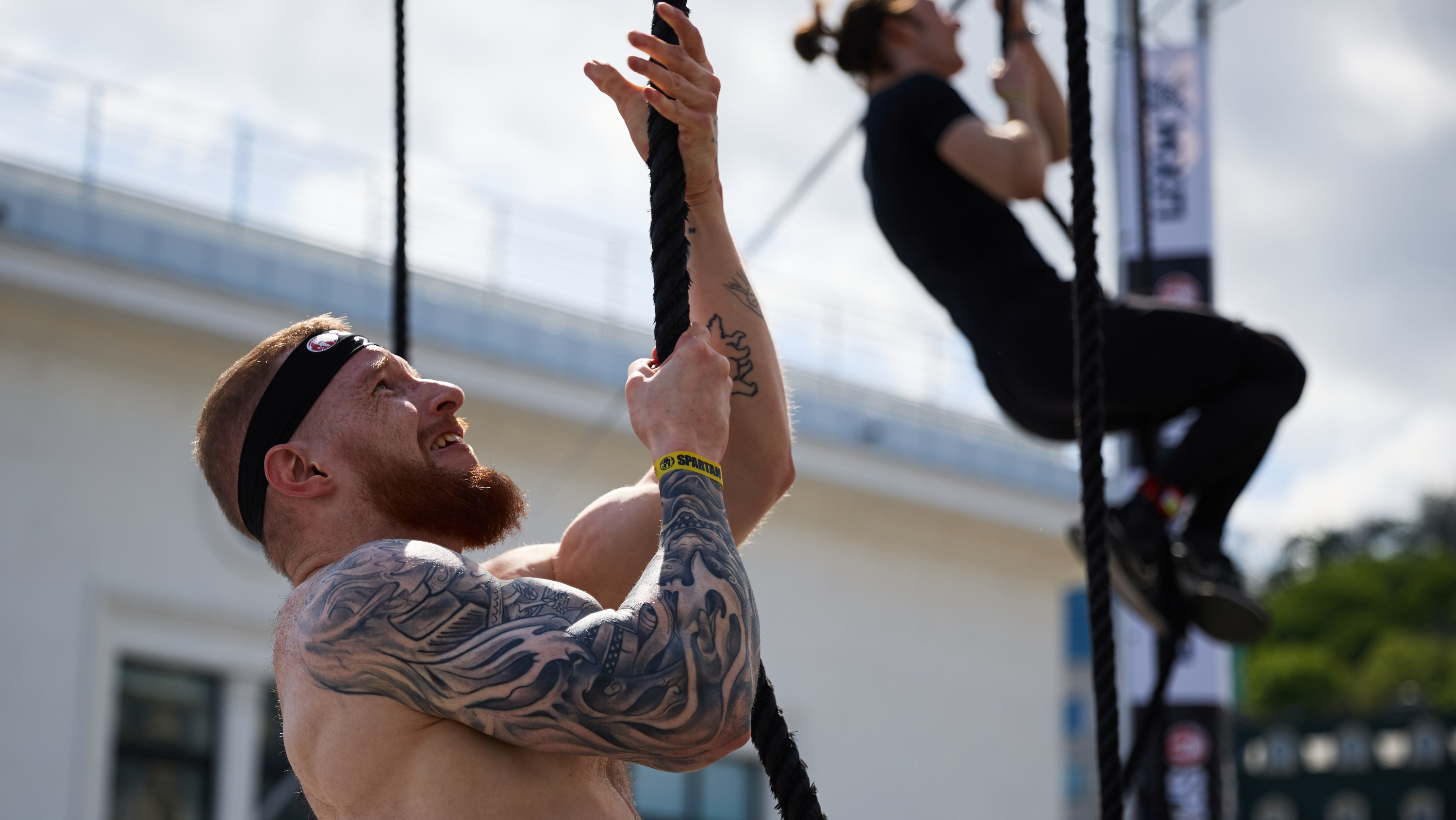 a photo of Spartan athletes doing the rope climb