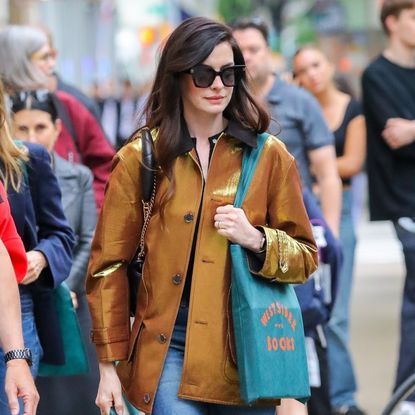 Anne Hathaway wearing a barn jacket in new york city