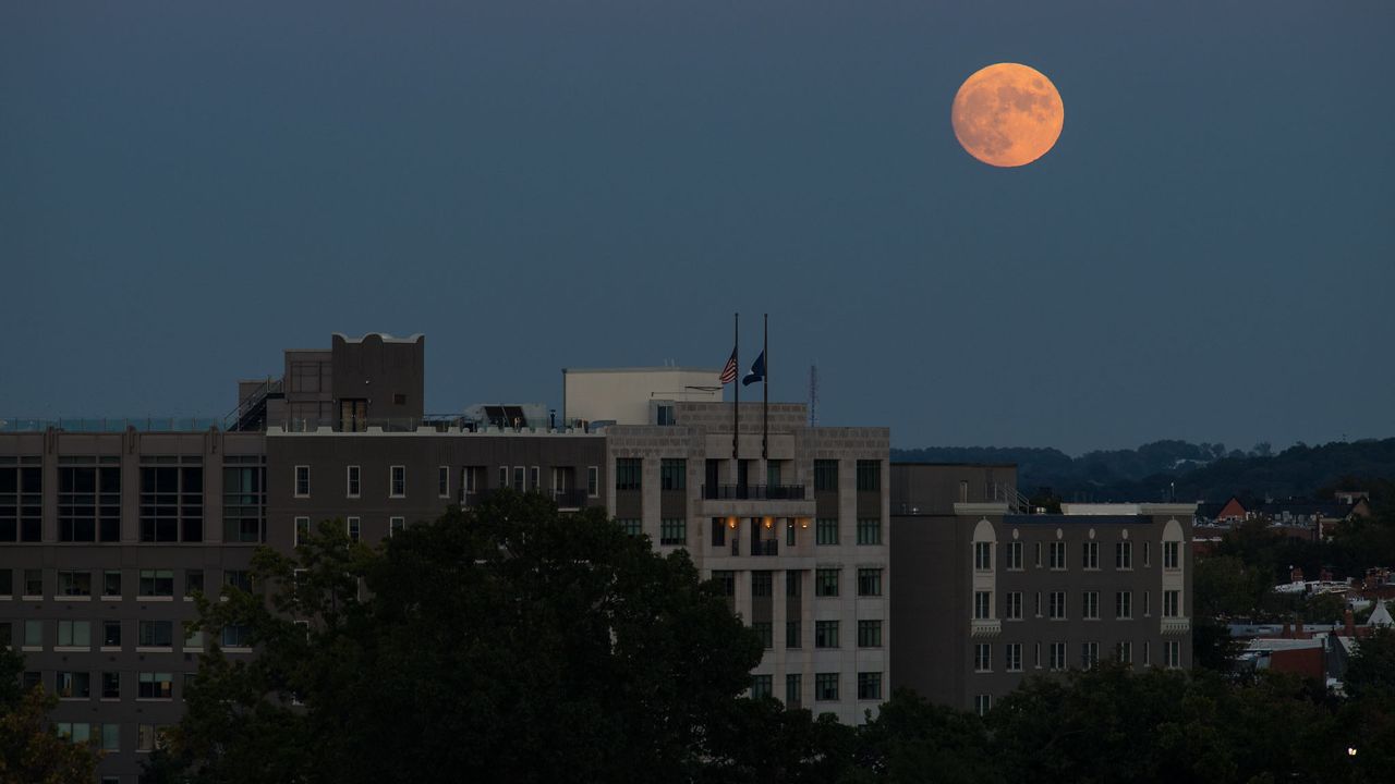 The nearly full moon is seen as it rises from The Observatory at America&rsquo;s Square in Washington, Tuesday, Oct. 19, 2021.