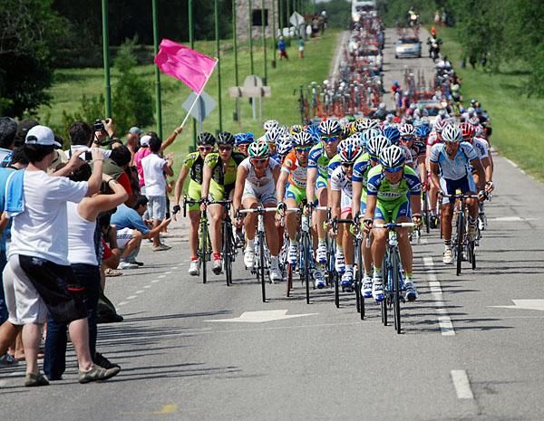 The Liquigas team is greeted by fans as it powers hard on the front.
