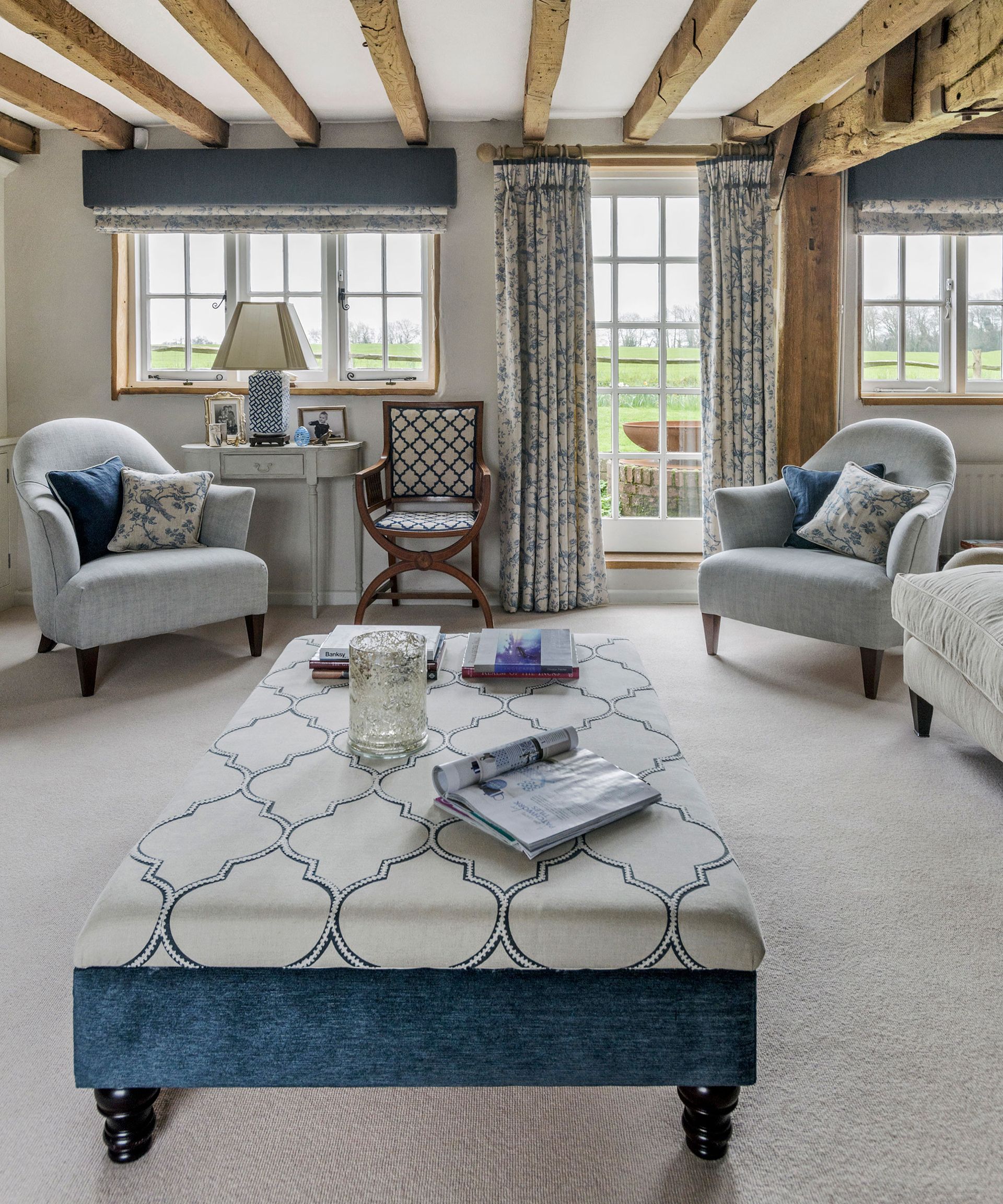 Living room with cream carpet and walls