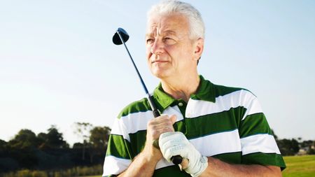 Thoughtful senior man on golf course