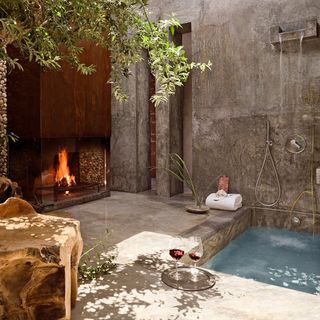 outdoor shower area with fire place