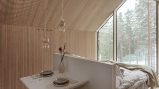 wood cladded bedroom in the forest