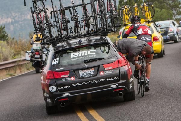 Taylor Phinney (BMC) gets his bike worked on after an early crash.