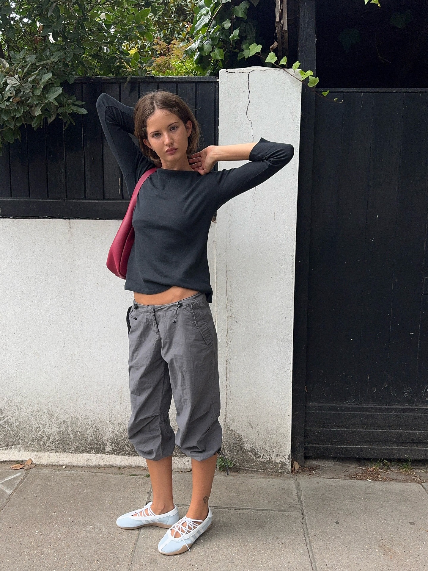 A woman wearing powder blue ballet sneakers