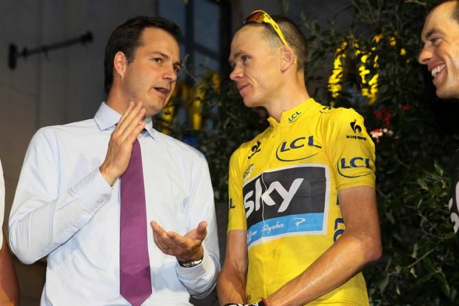 Chris Froome (Sky) talks to a local politician