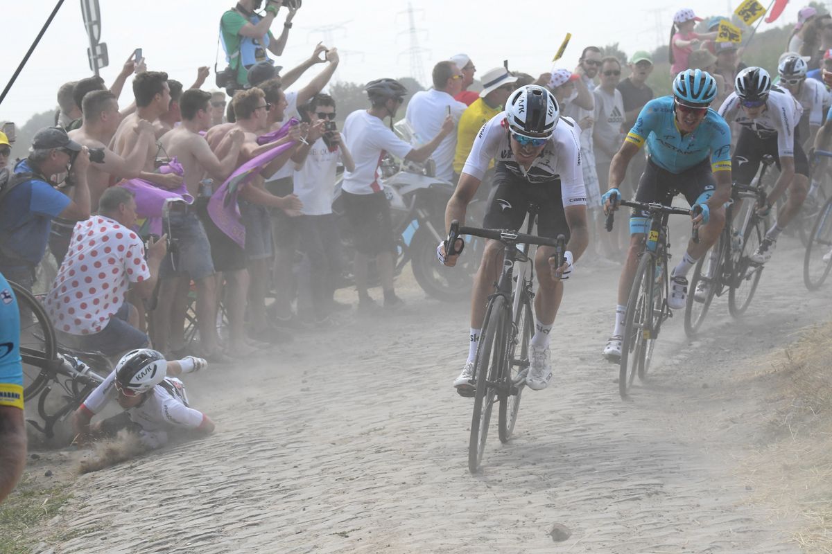 Michal Kwiatkowski (Team Sky - right) got a cobbled turn wrong