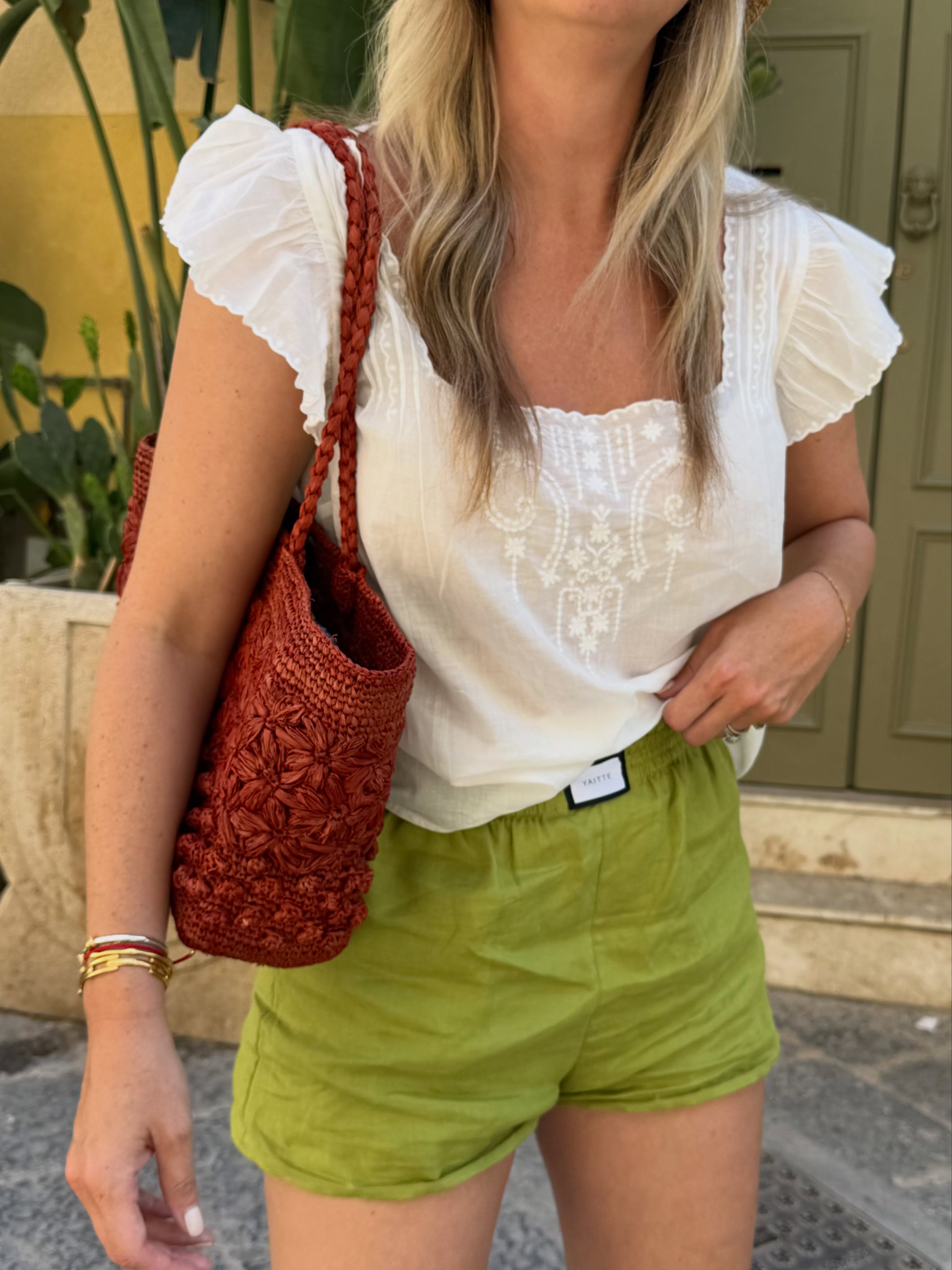 An image of a woman wearing green apple color trend summer 2026