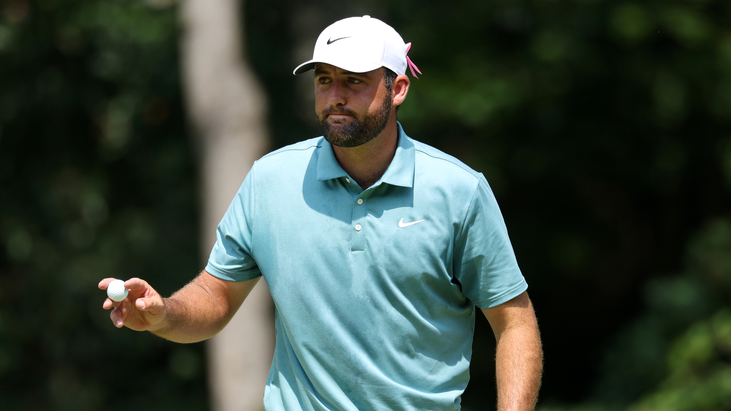 Scottie Scheffler acknowledges the crowd during the final round of the 2025 BMW Championship