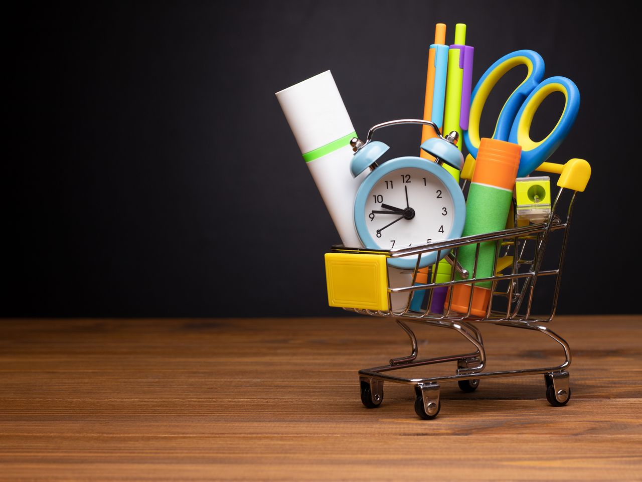 mini grocery cart filled with school supplies