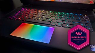 Closeup of the Alienware Area-51 gaming laptop's RGB keyboard and RGB touchpad. There is a badge on the image that reads, "Editor's Choice Windows Central."