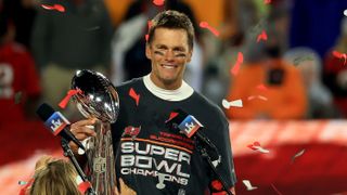 Tampa Bay Buccaneers quarterback Tom Brady lifts the Vince Lombardi Trophy after winning Super Bowl LV