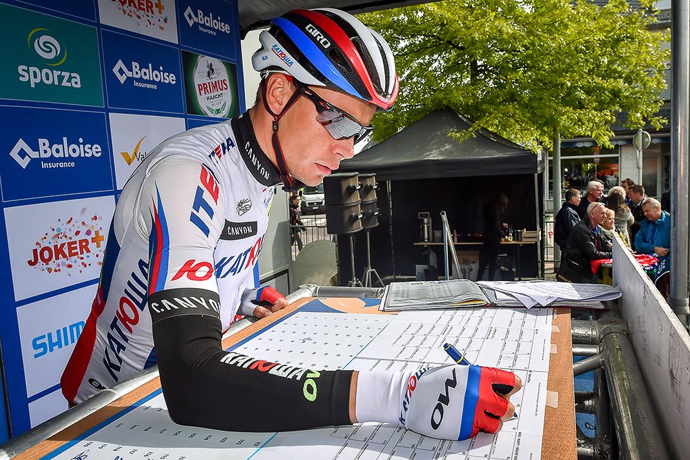 Riders sign in before the final stage in Belgium.