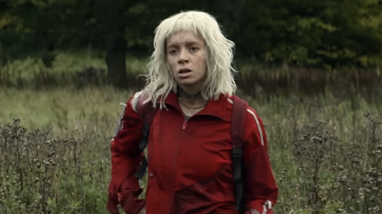 Jimmy Ink in red tracksuit in 28 Years Later: The Bone Temple