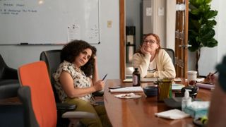 Azmina (Kimia Behpoornia), and Hannah (Rachel Bloom) working in an office in Reboot