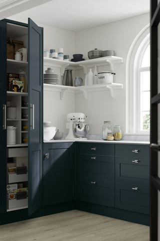 navy blue kitchen with cabinets and open shelving