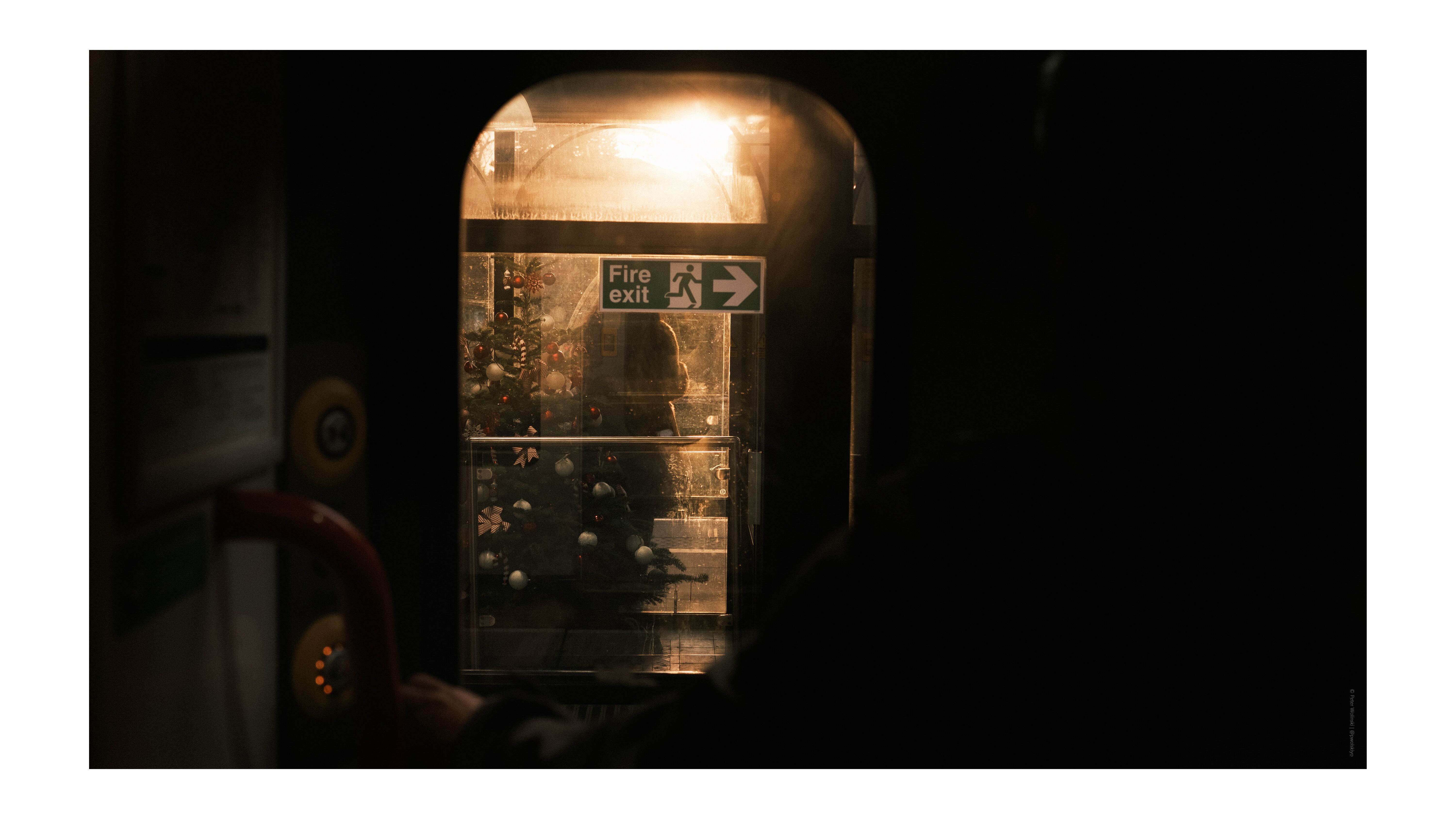 A photo of a train door in the evening hazy light, taken on the Fujifilm X-E4