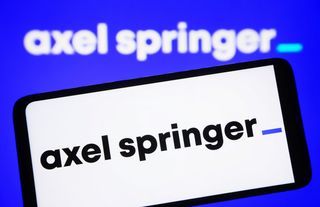 Axel Springer logo displayed on a smartphone screen