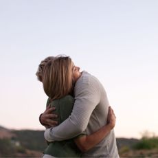 How to help a depressed boyfriend: A woman and man hugging