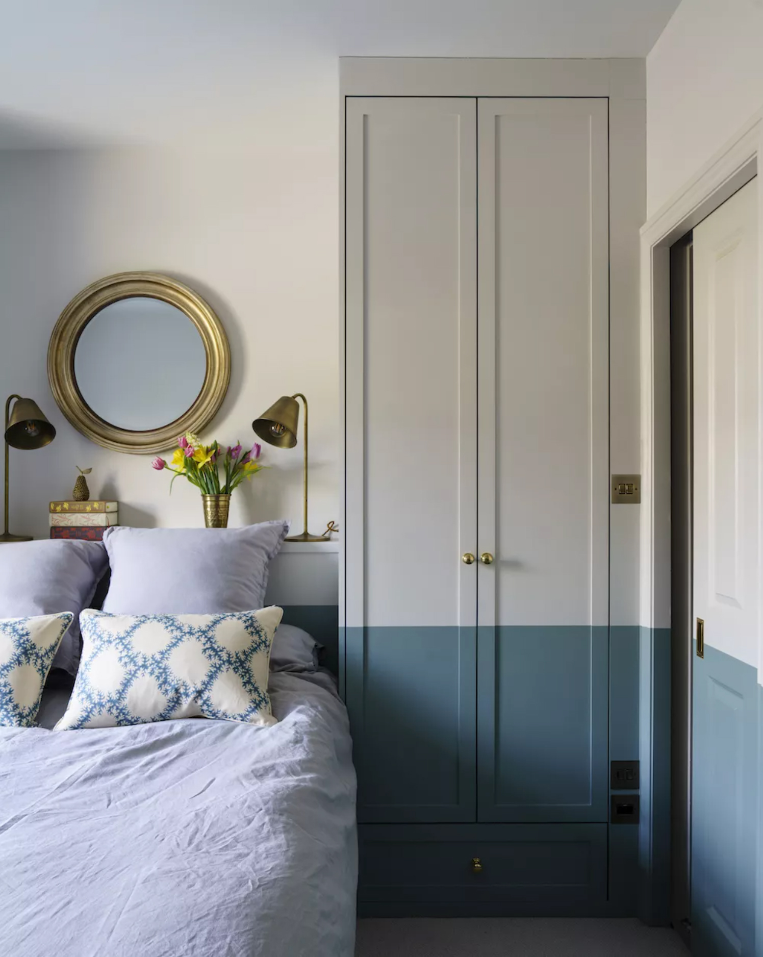 Blue bedroom painted half with blue paint and half with grey with grey bedding