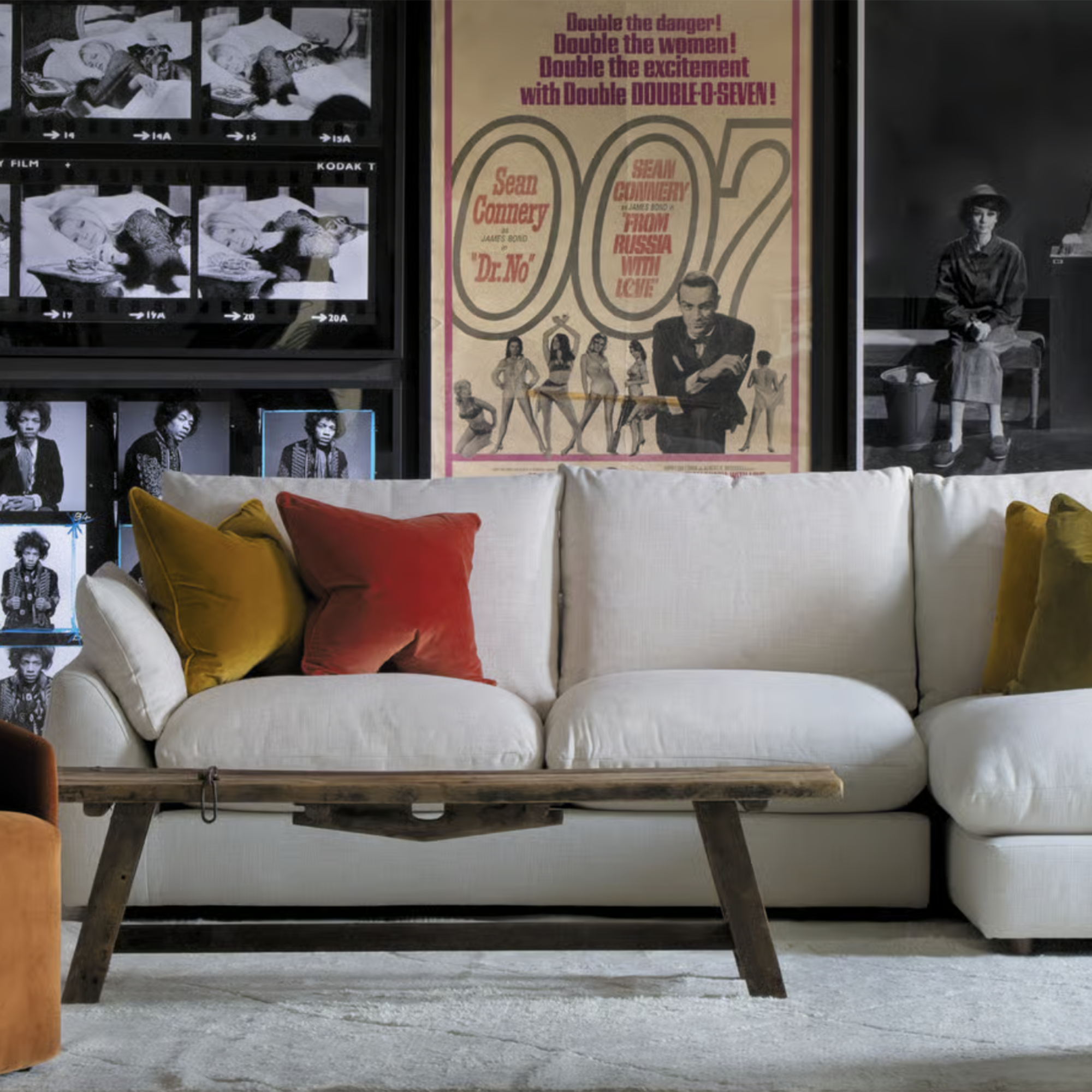 white sofa in with a 007 print behind it