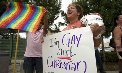 Carri Jo Anderson protests in front of a Chick-fil-A in Pompano Beach, Fla., in August 2012. The company's Christian owners are against same-sex marriage.